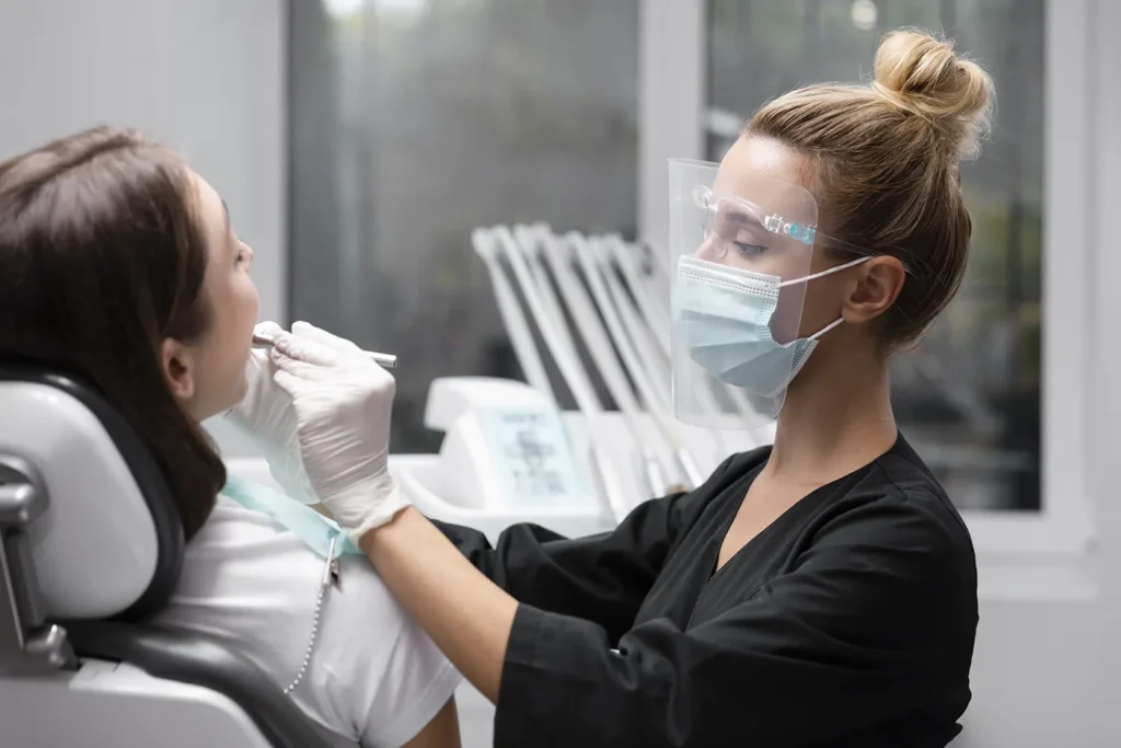 dentist performing dental check-up on patient to ensure dental health